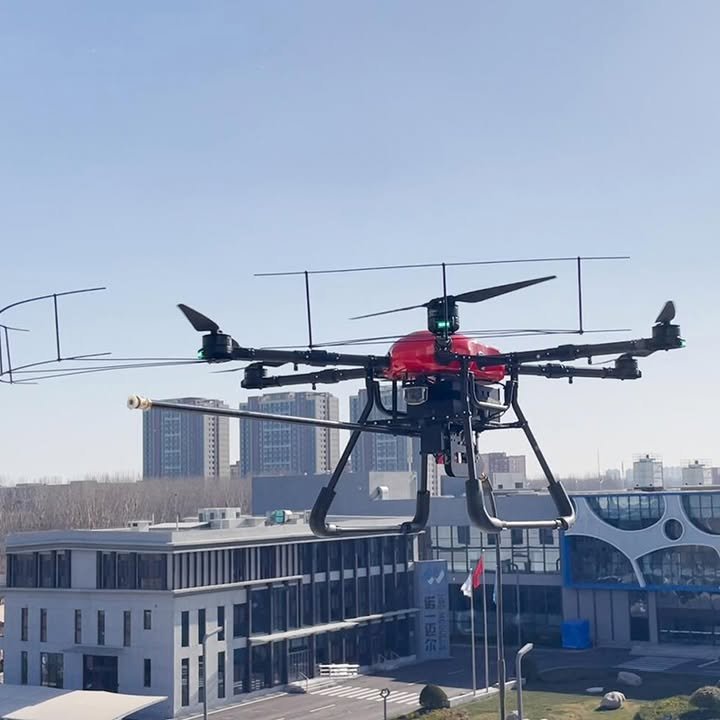 Commercial industrial cleaning drone in flight for high-rise facade and solar panel cleaning